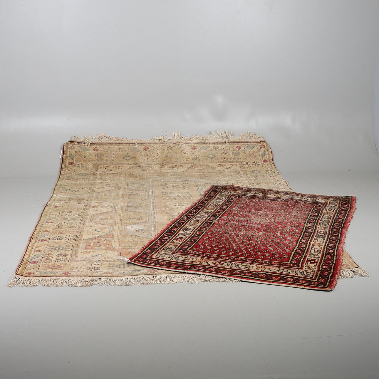 A MELAS CARPET AND A SERABEND RUG.