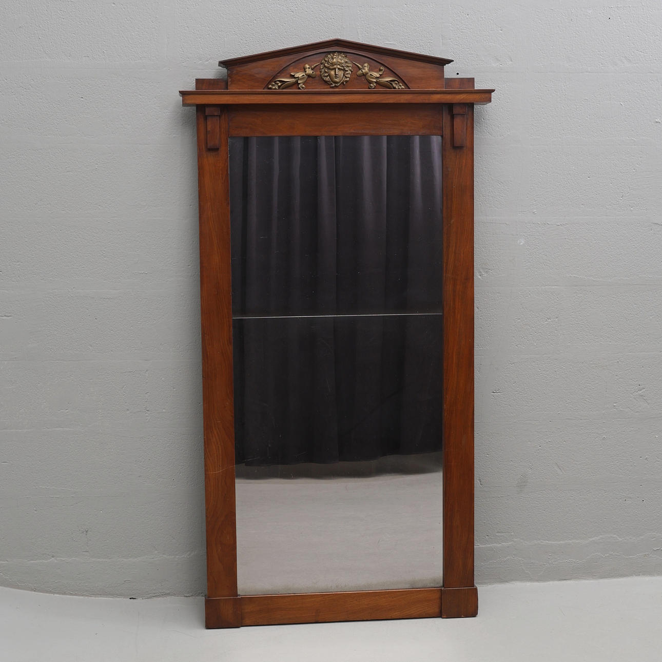 An empire mirror, 19th century.