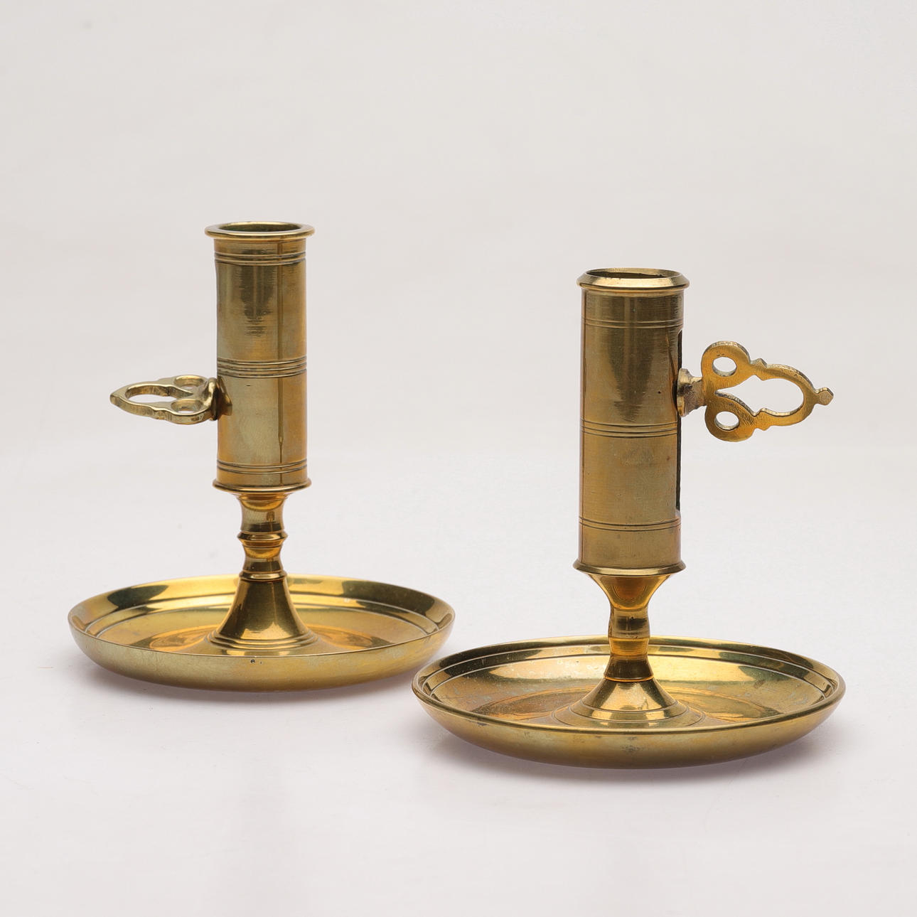 Two brass candlesticks, 20th century.