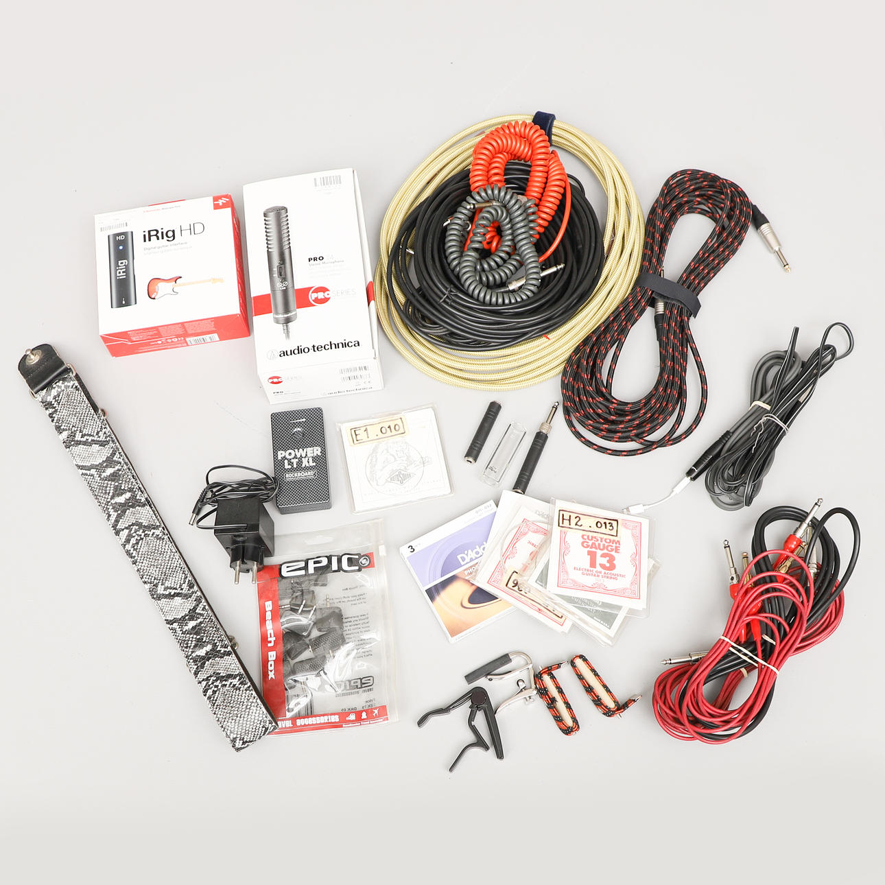 VARIOUS CABLES AND ACCESSORIES, including telecommunication cables, microphone and strings.