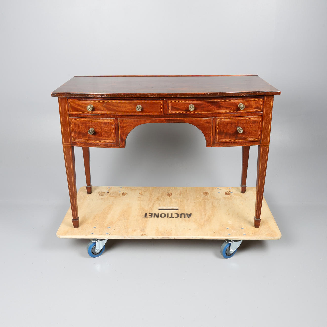 EDWARDIAN MAHOGANY BOW FRONTED SIDE TABLE.