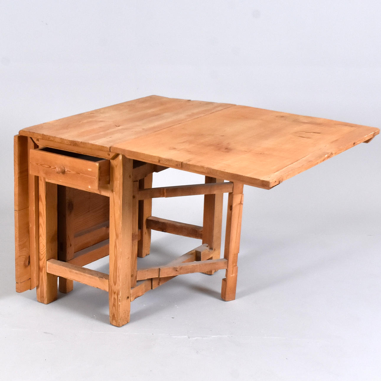 A 19th century pine folding table.