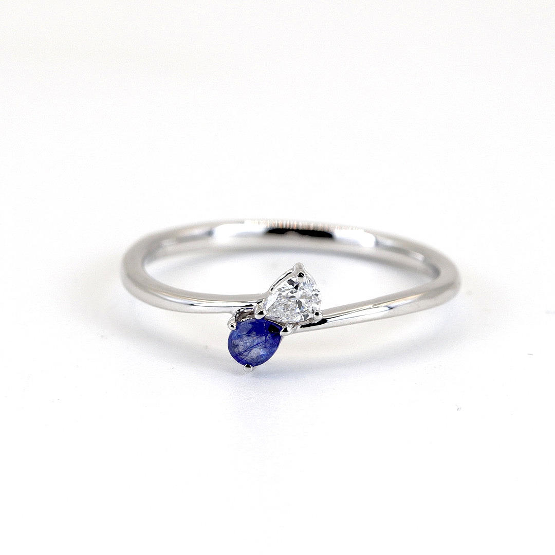 PEAR CUT SAPPHIRE AND DIAMOND 9CT RING.