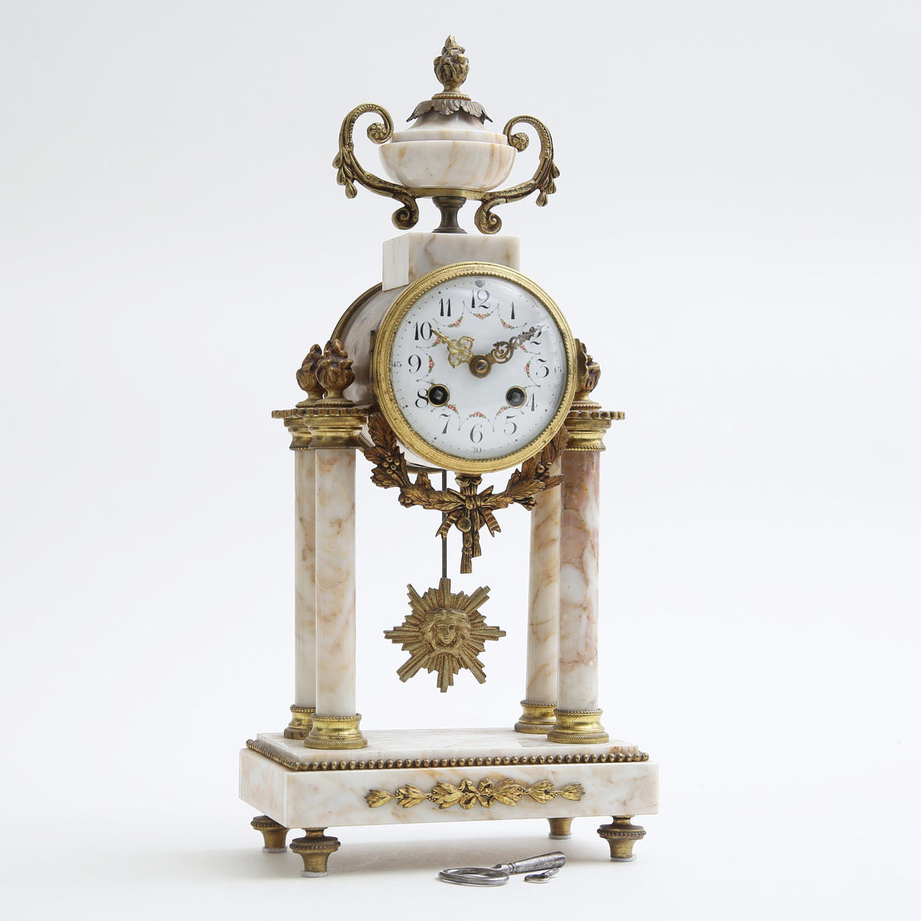 A marble/ brass table clock, 1800/ 20th century.
