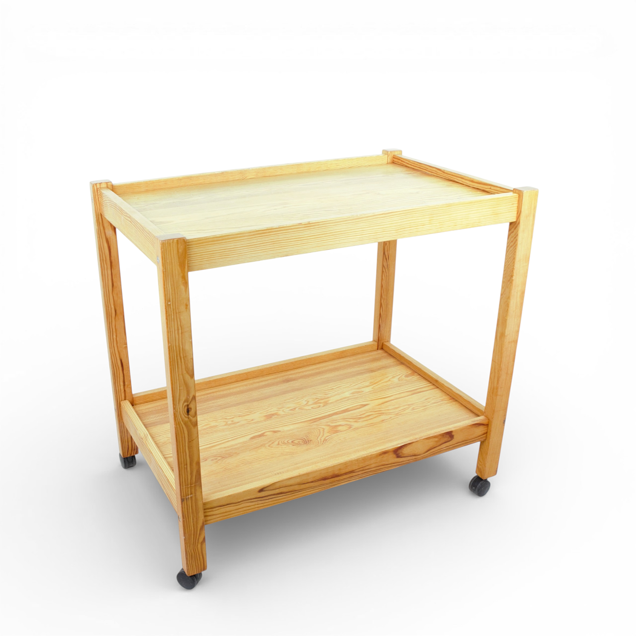 A 1970's lacquered pine dining trolley.