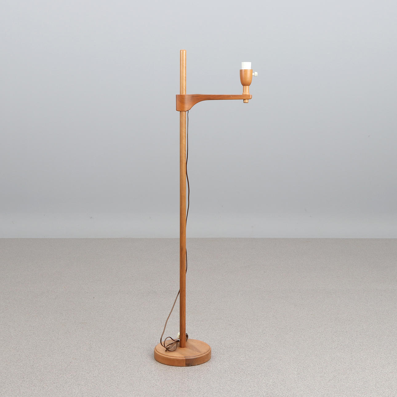 CARL MALMSTEN. FLOOR LAMP. Walnut. “Stake”, marked CM underneath.