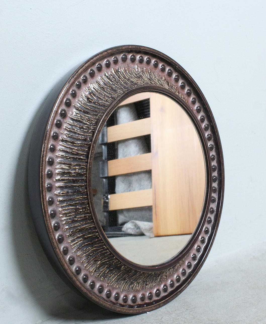 Round ceramic framed mirror, 1970s.
