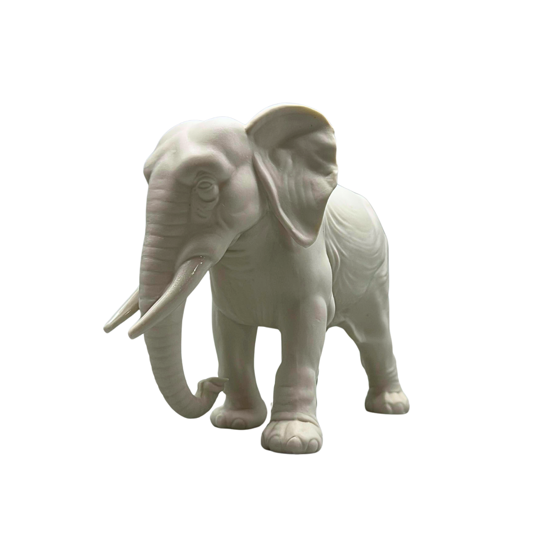 PORCELAIN ELEPHANT FIGURINE.