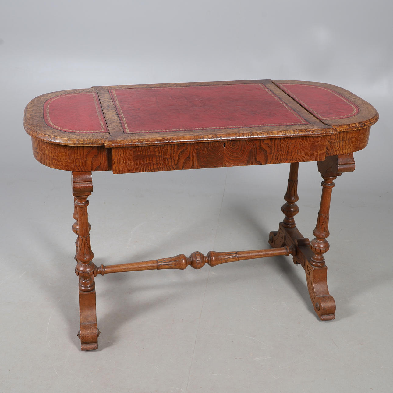 A VICTORIAN ASH WRITING TABLE.