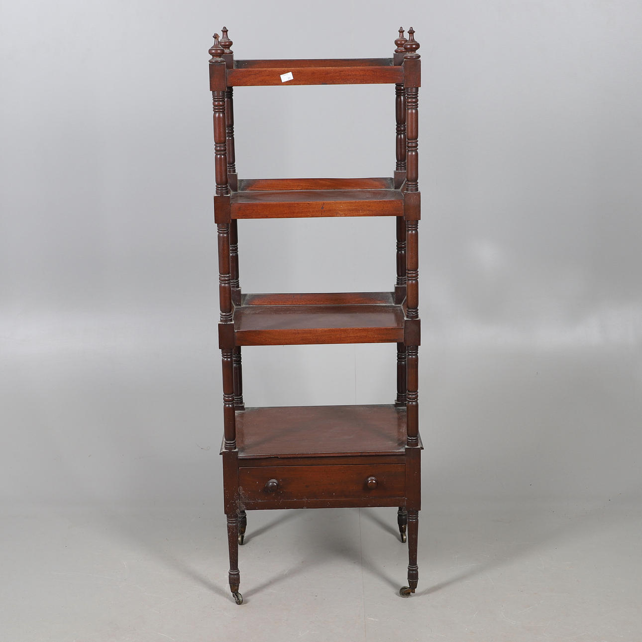 A REGENCY MAHOGANY FOUR TIER WHAT NOT.