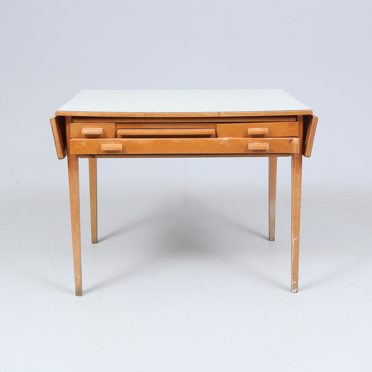 A TABLE WITH DRAWERS, 1950'S.