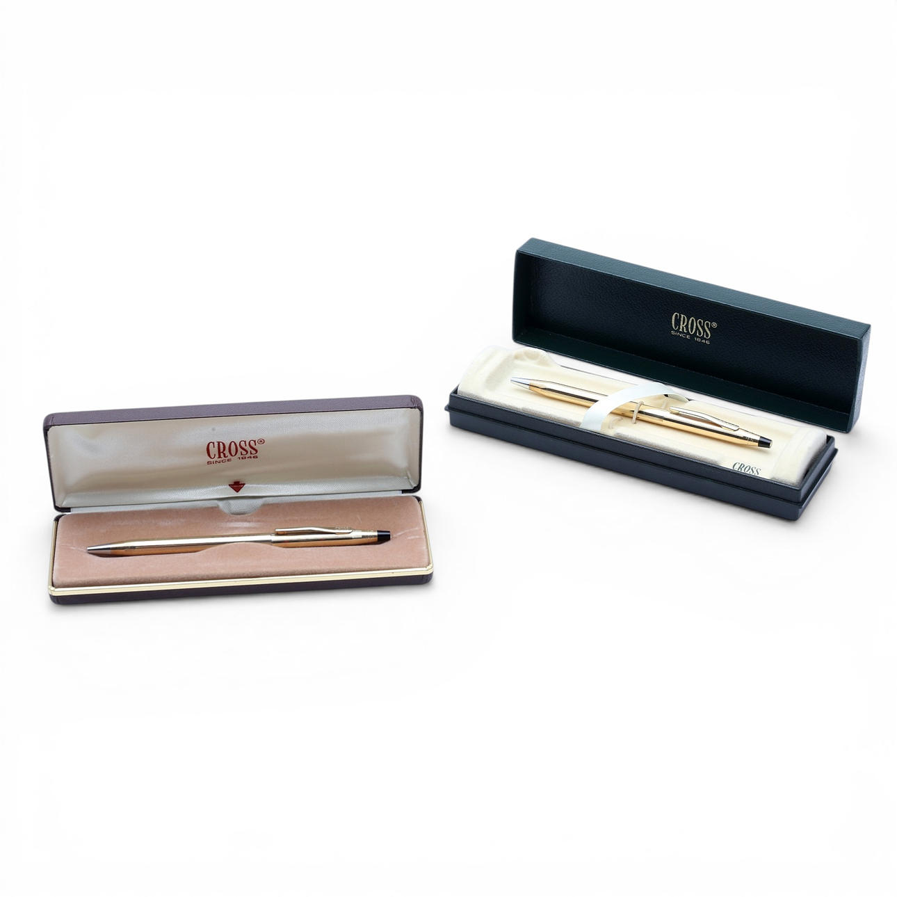 Two gold-plated Cross pens.