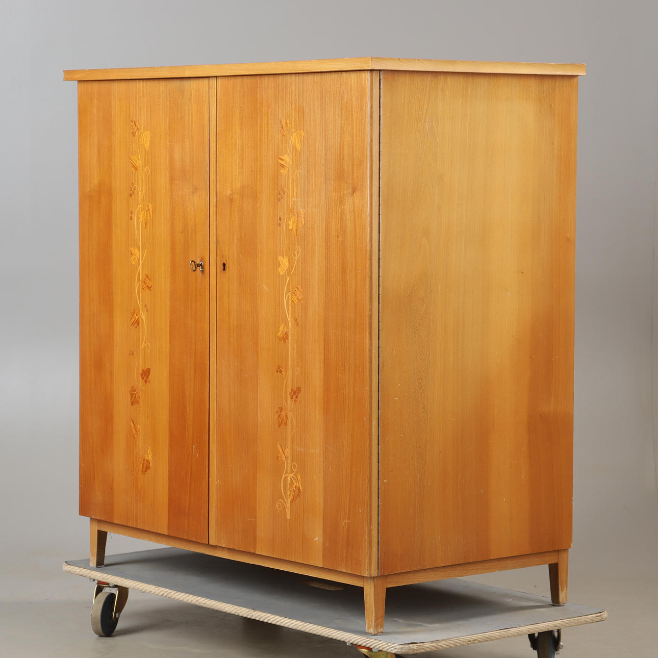 A 1940s intarsia cupboard.