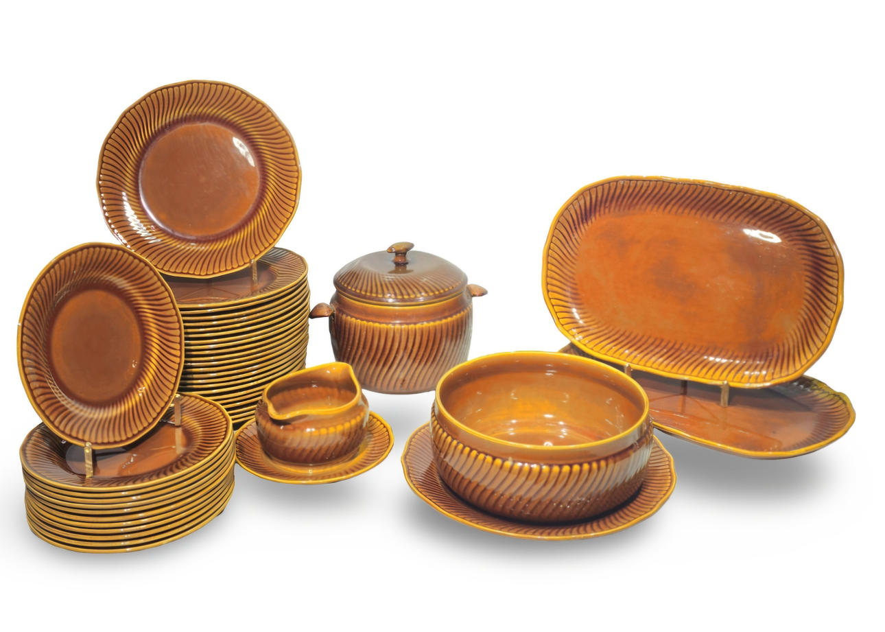 Amber-colored glazed ceramic tableware. Boch, Belgium.