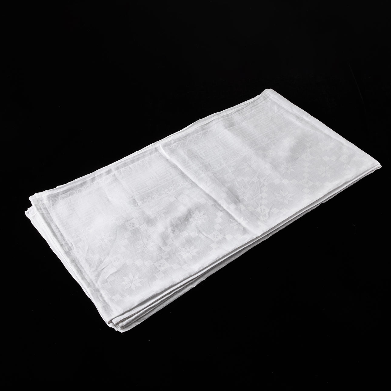 TABLECLOTH, linen damask, mirror with overlay, drawer-like pattern, wide border of meander loop flanked by thinner borders, embroidered monogram (IF).