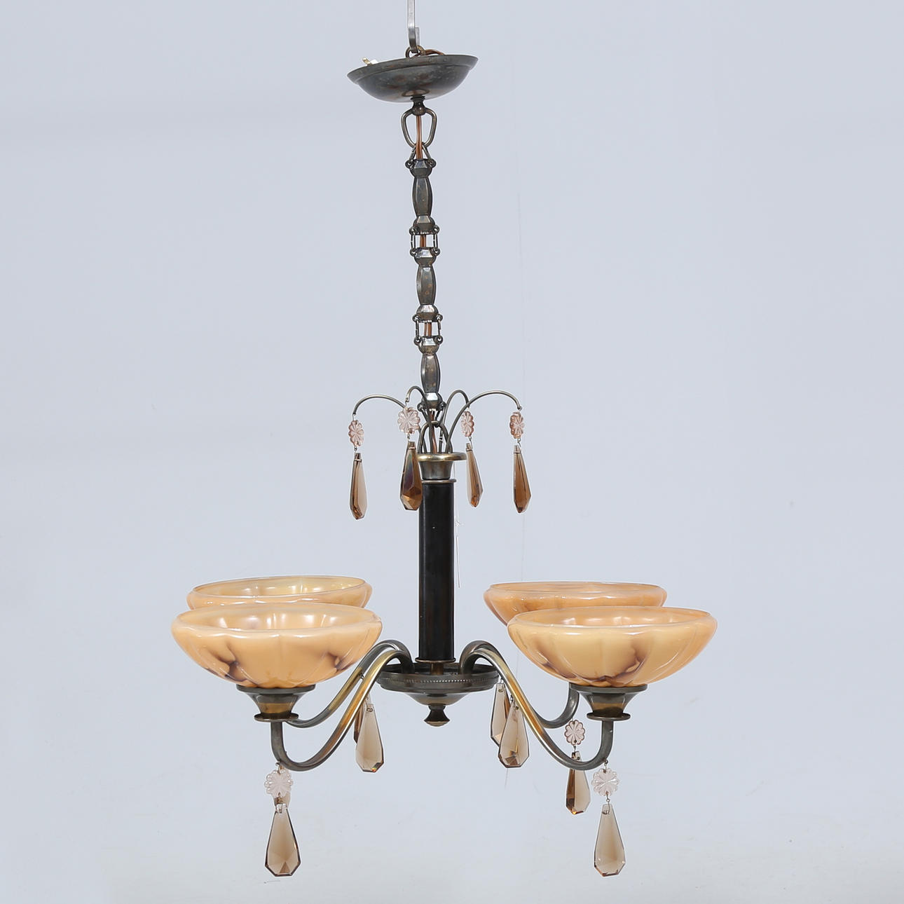 A 1930's ceiling lamp, prisms and glass cups.