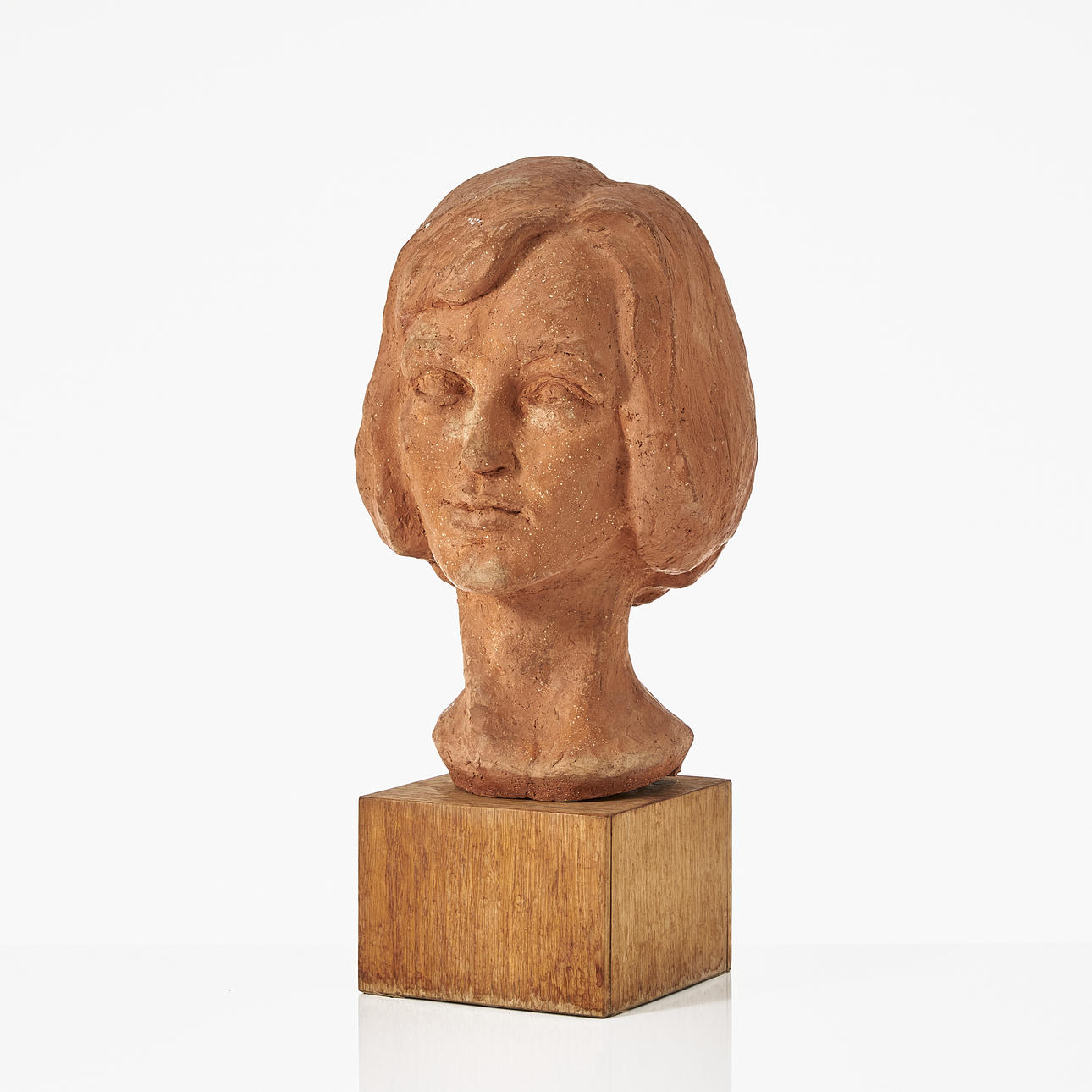 OSCAR ANTONSSON (1898-1960). byst, föreställande kvinna, terrakotta, monterad på sockel, signerad.