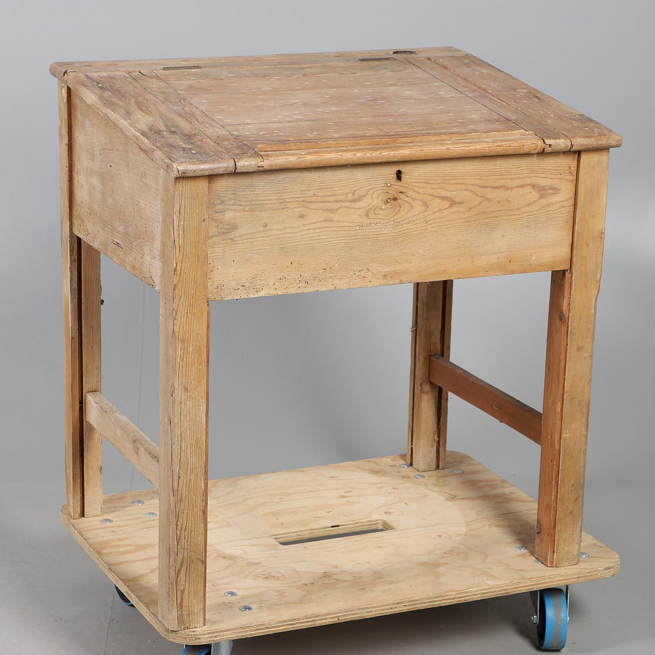 A STRIPPED PINE SCHOOL DESK.