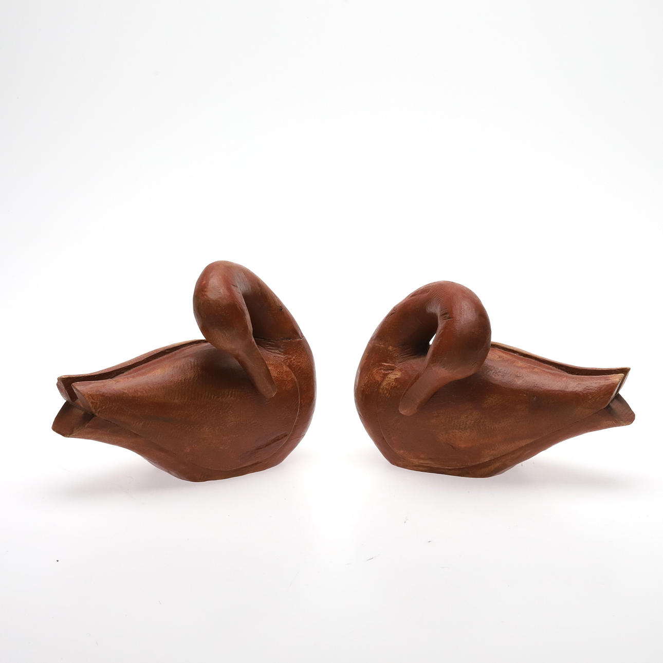 WOODEN SCULPTURES, swans, a pair.