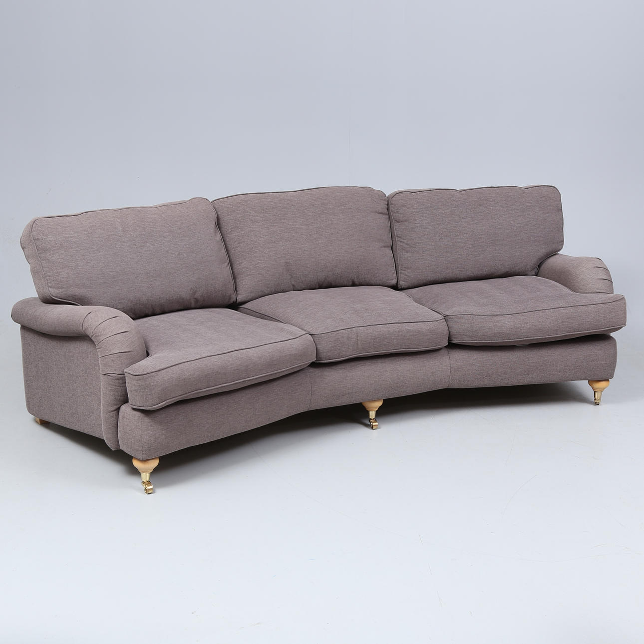 A three-seat, swung Howard model sofa, Mio, 2000's.