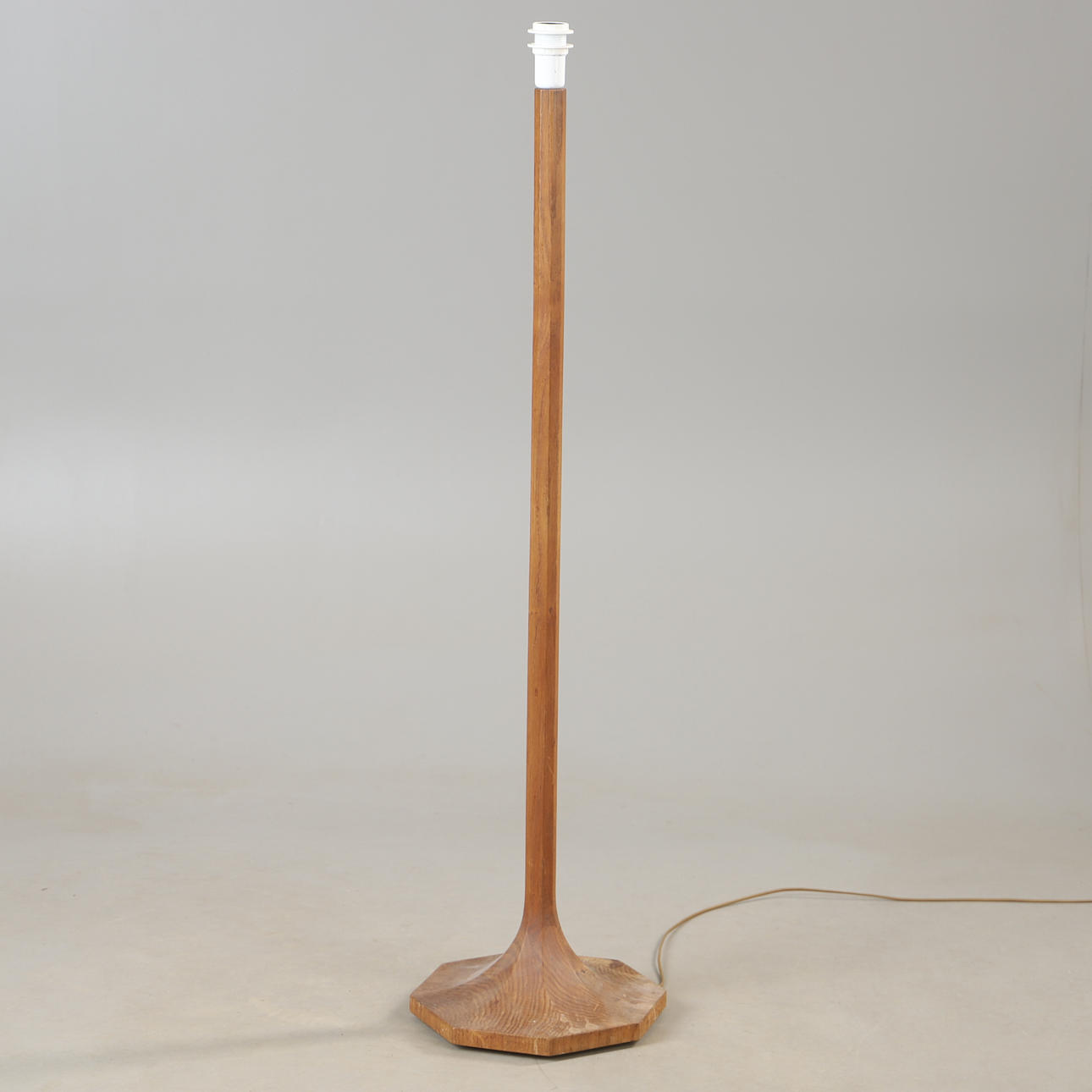 A mid 20th century oak floor lamp.