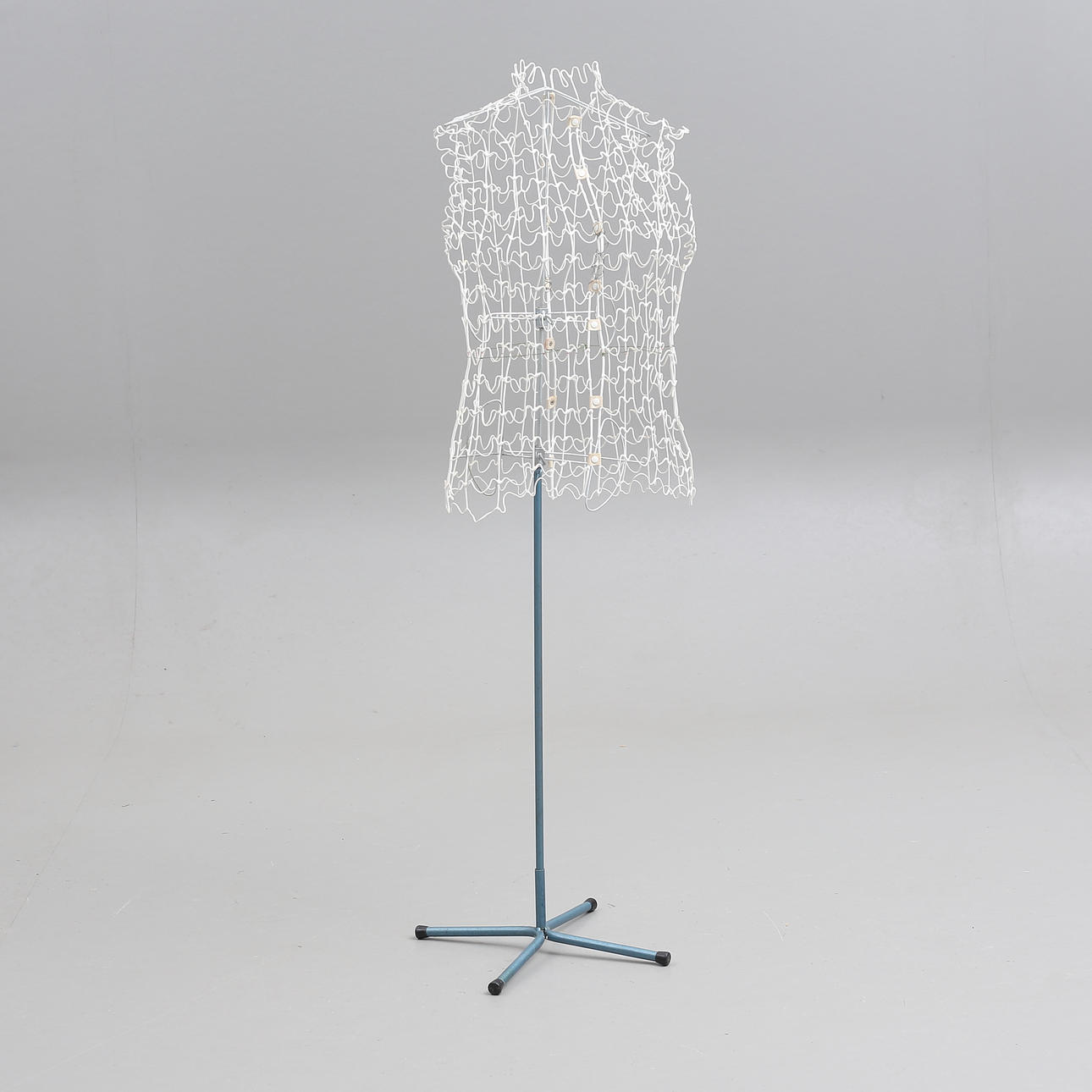 A mock-up doll, string, metal stand, circa mid 20th century.
