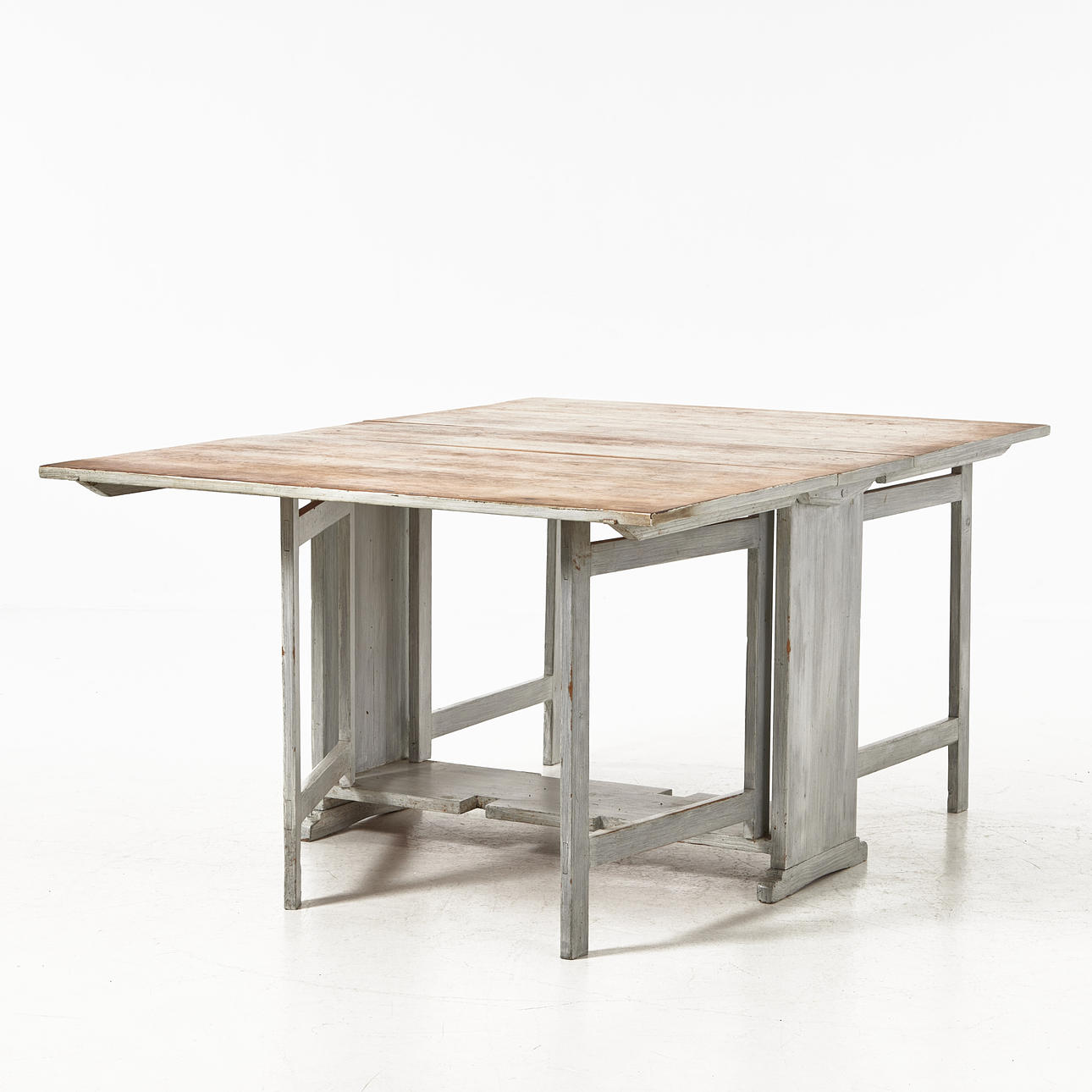 A 19th century beater table, pine, undercarriage painted in grey, double knobs and gates.