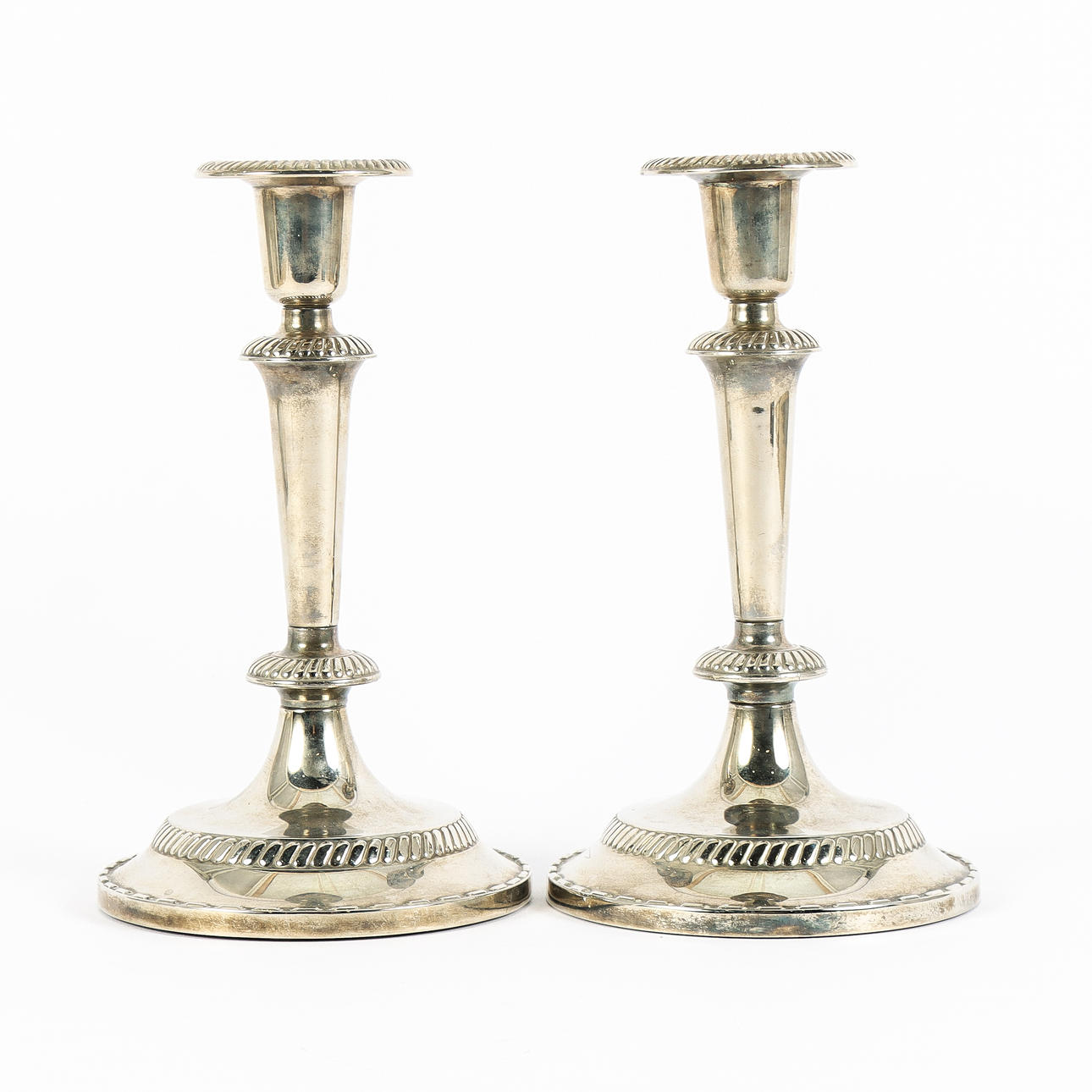 A pair of candlesticks, nickel silver.