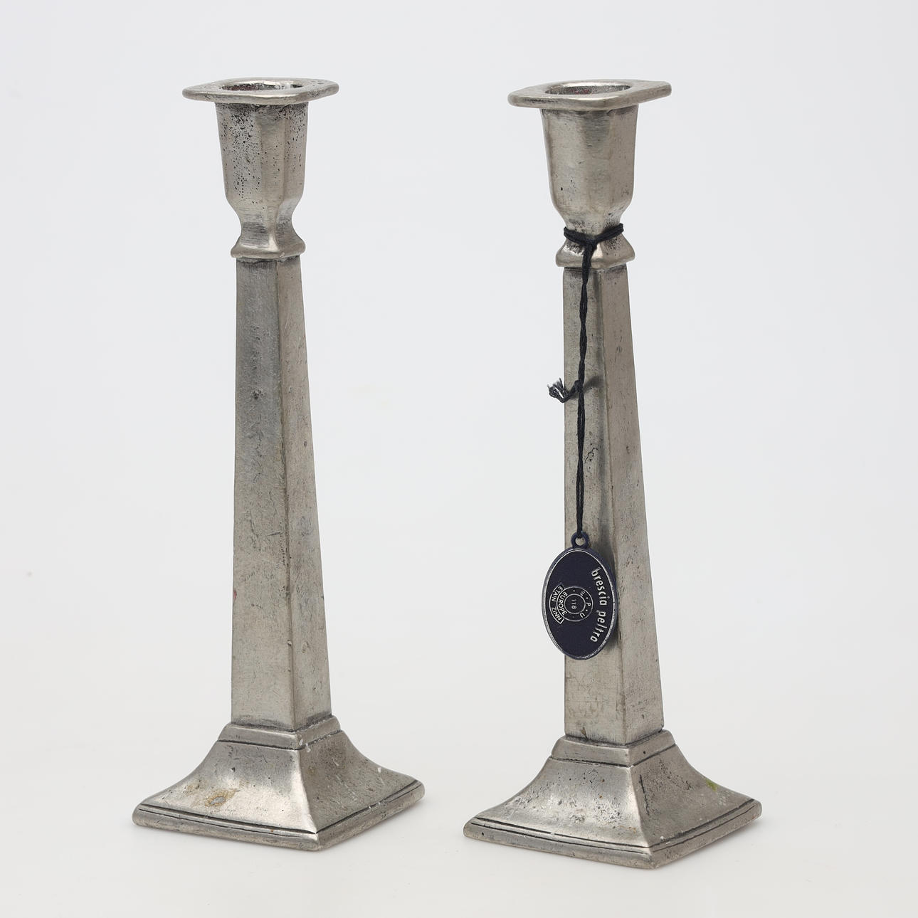 A pair of pewter candlesticks.