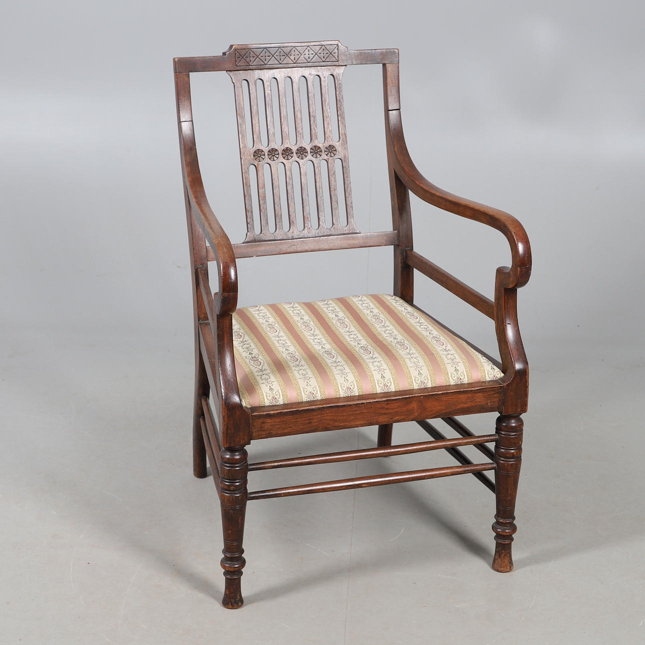 A 19TH CENTURY BEECH OPEN ELBOW CHAIR.