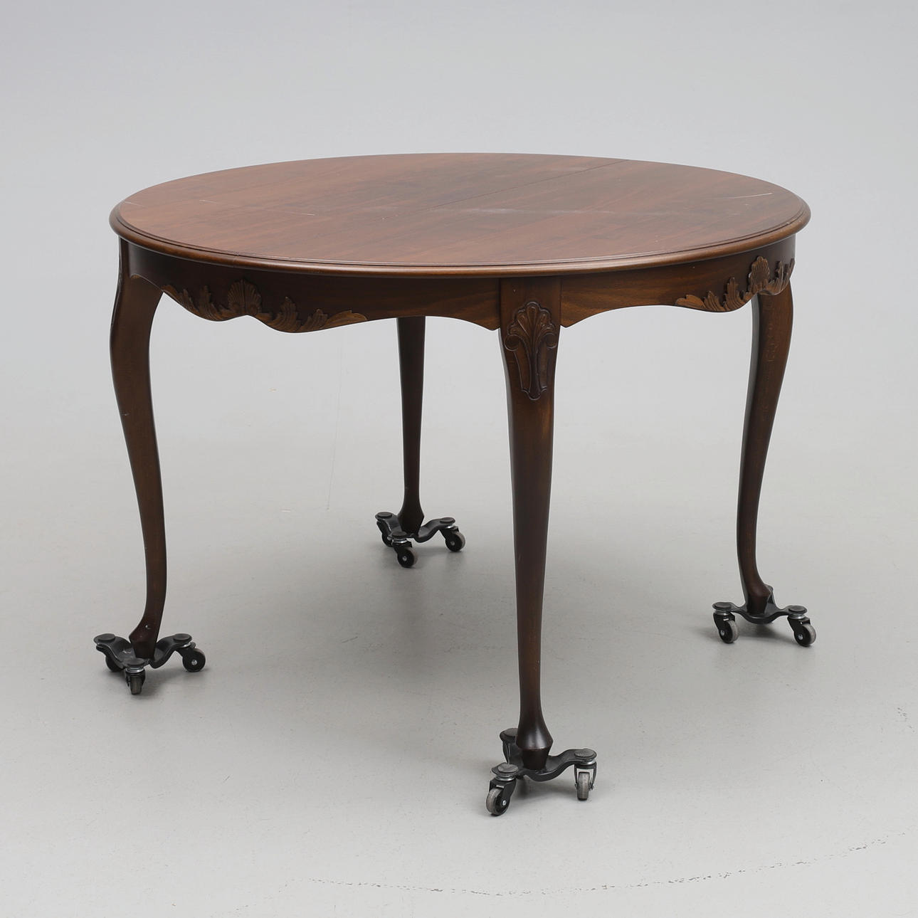 DINING TABLE. Rococo style, with inserts.