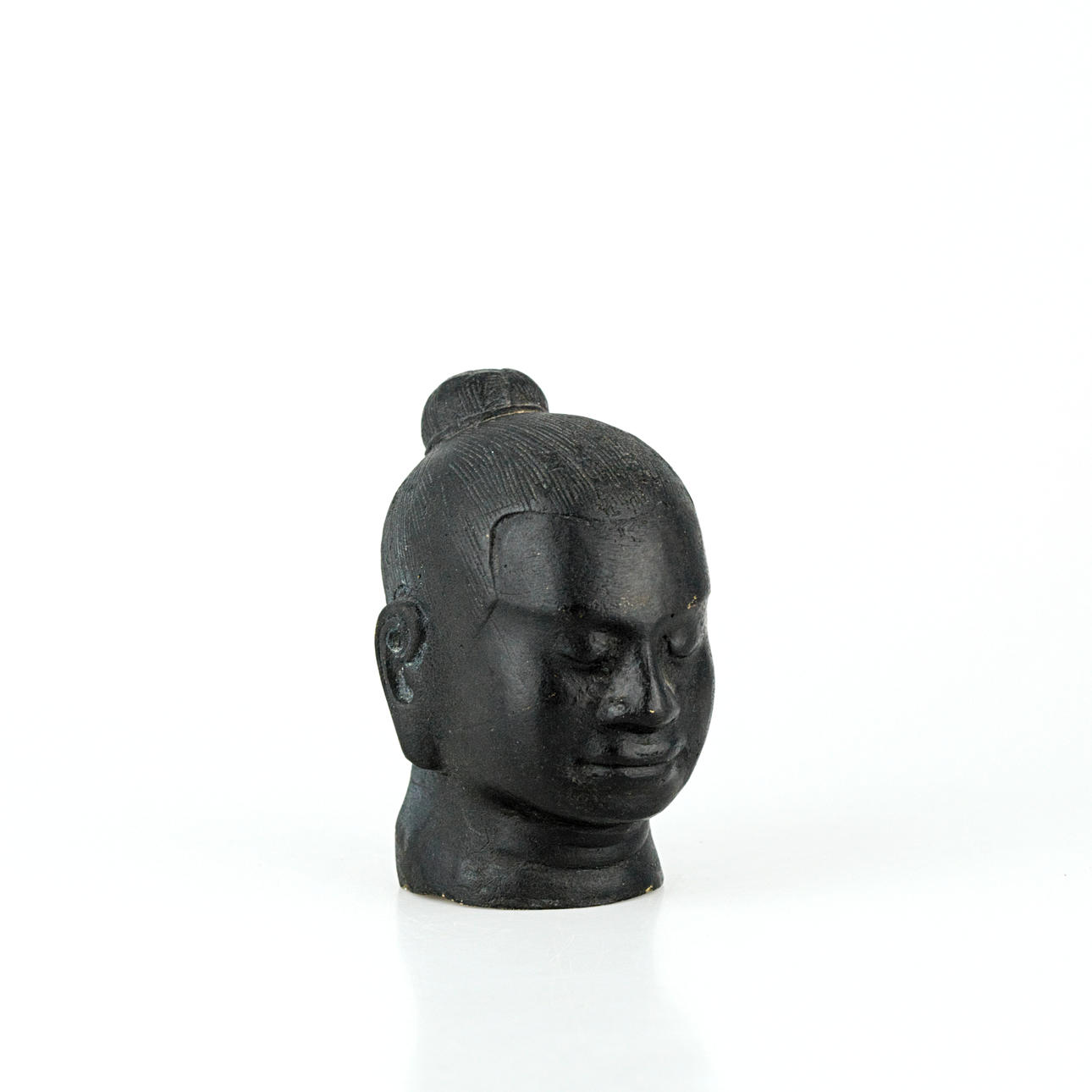 A 20th-century Buddha head, possibly bronze.