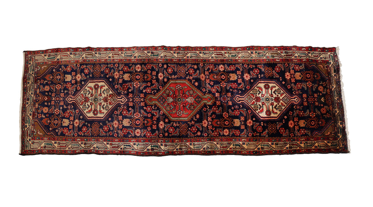 AN IRANIAN TAJ ABAD WOOL RUNNER.