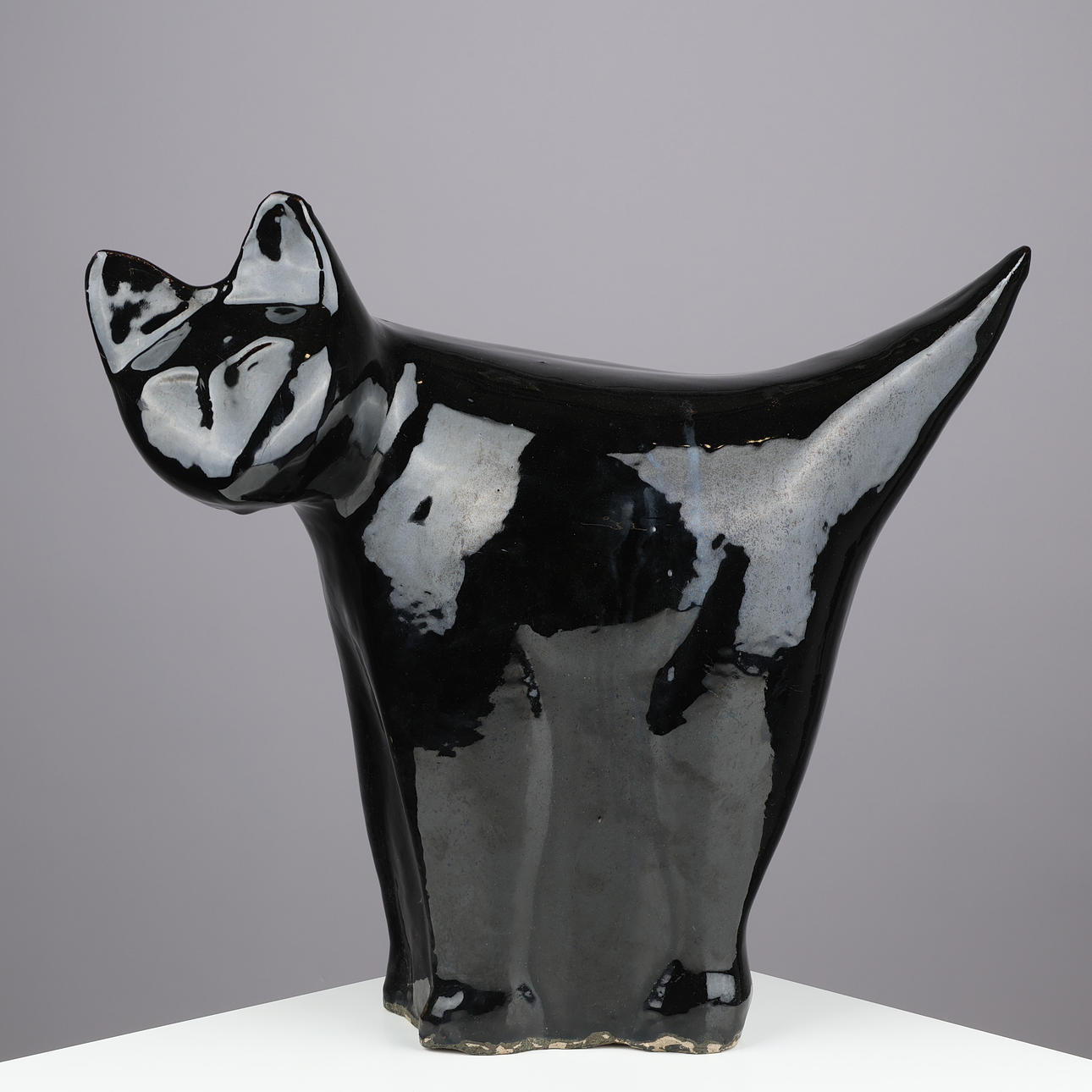 Large cat-shaped sculpture executed in black-glazed stoneware, unknown designer, 20th century.
