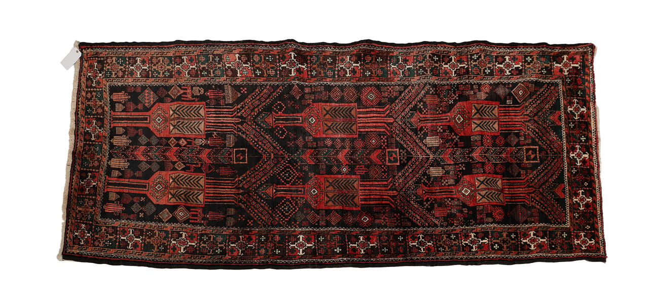 AN IRANIAN BALOUCH WOOL RUNNER.