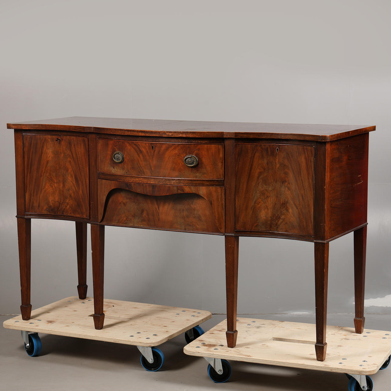 A GEORGE III STYLE MAHOGANY SIDEBOARD.