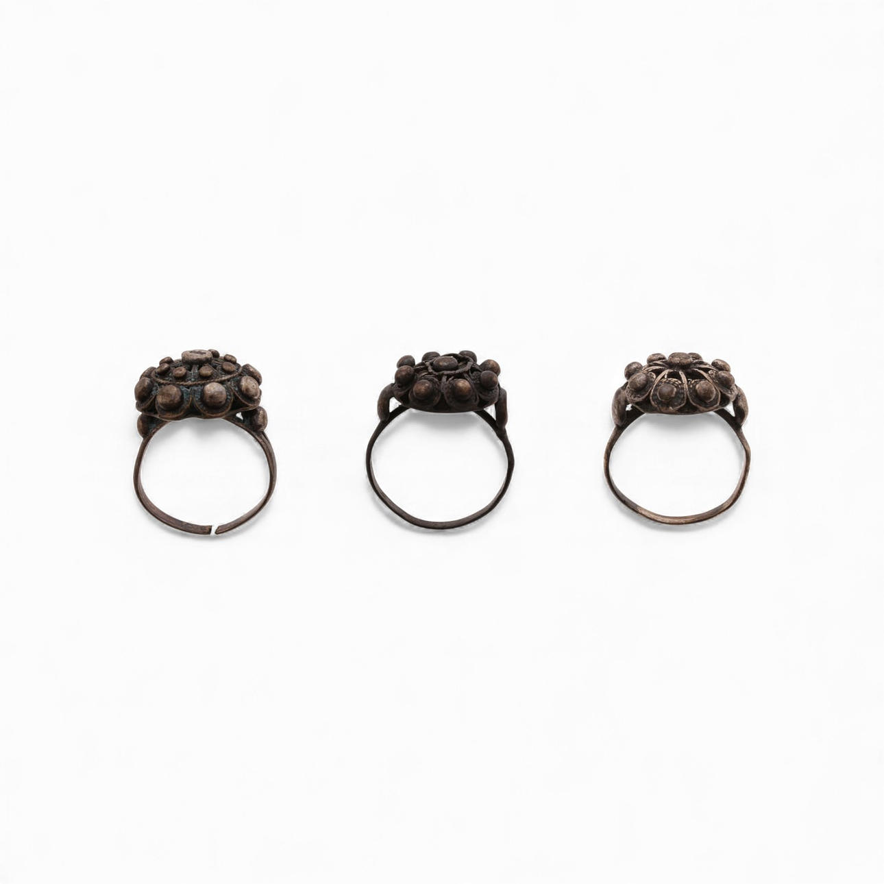 Three "charro" salamantine button rings in silver.
