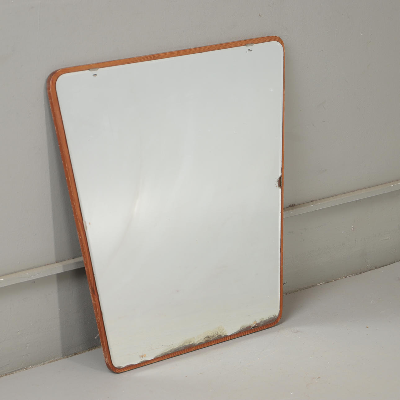 A mid 20th century teak mirror.