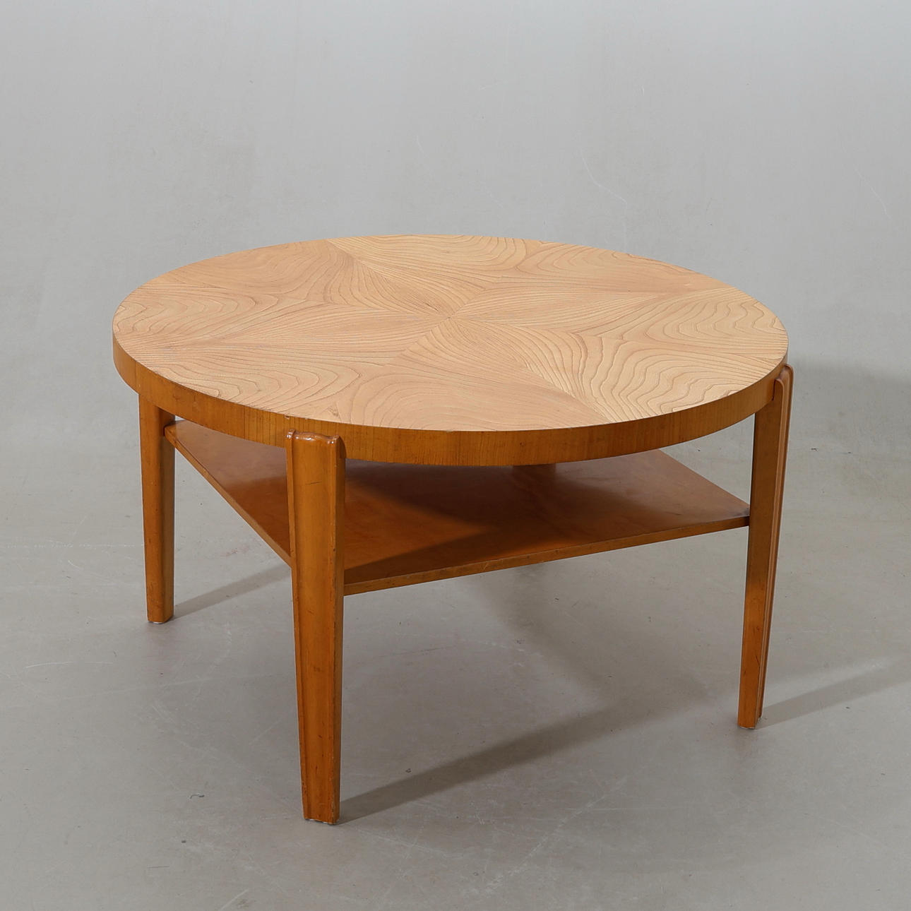 A Swedish Modern elm coffee table, 1940s.