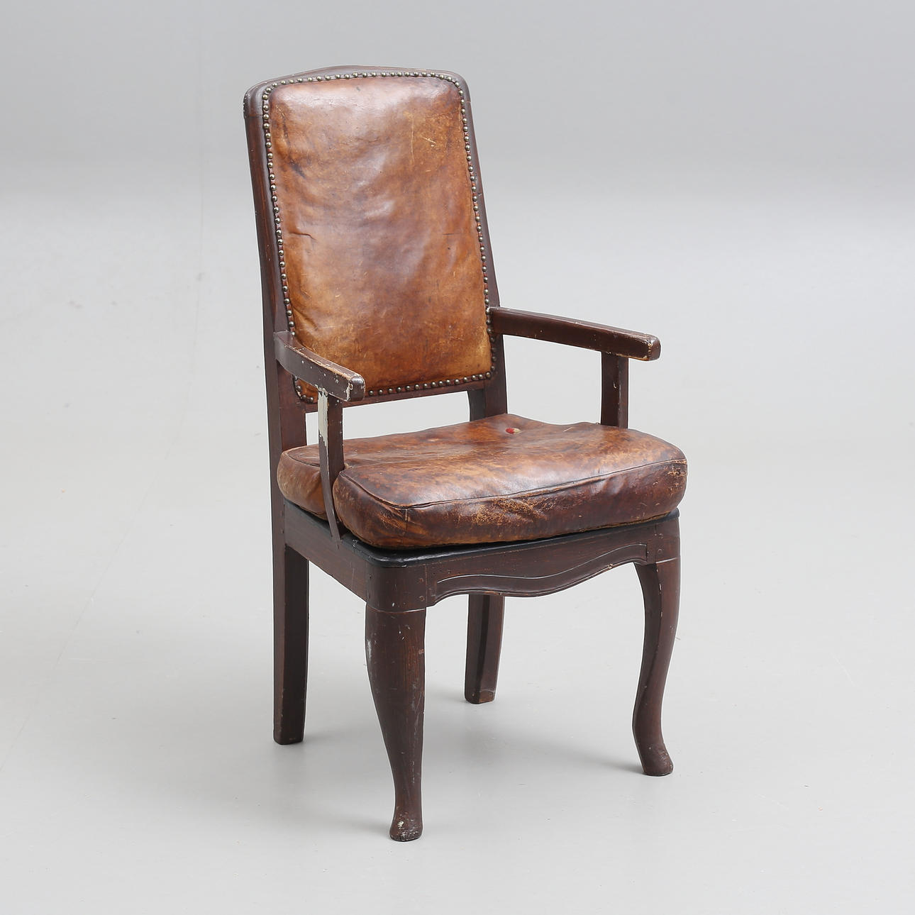 A 19th century peasant rococo armchair.