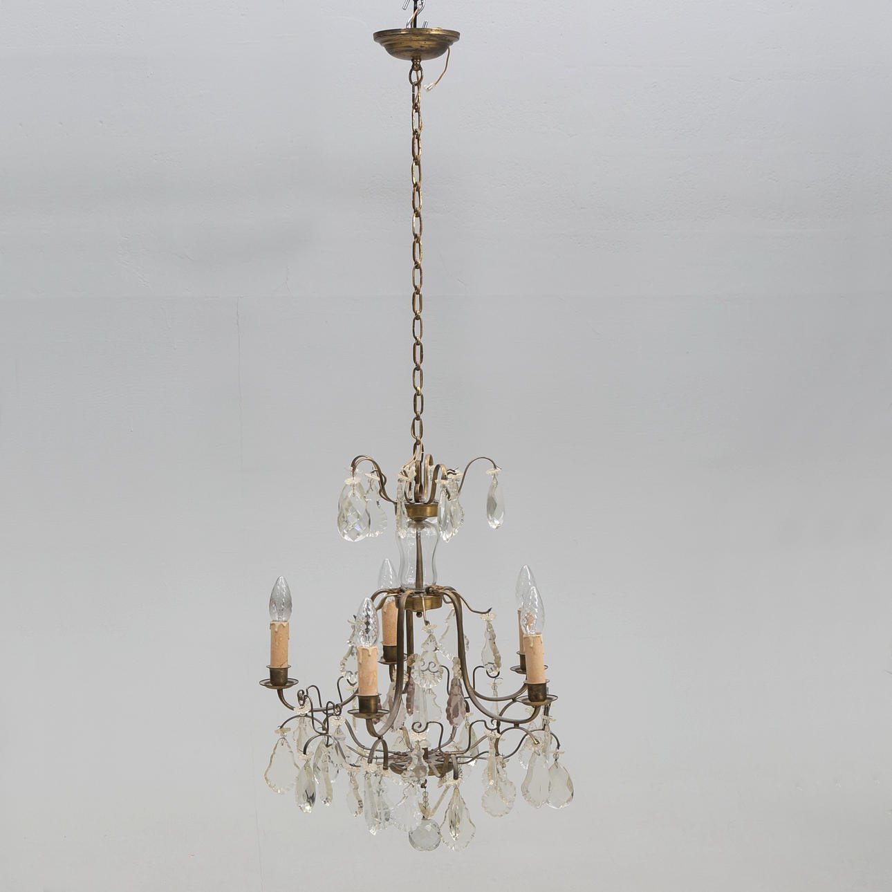 CHANDELIER. Rococo style, brass with prisms.