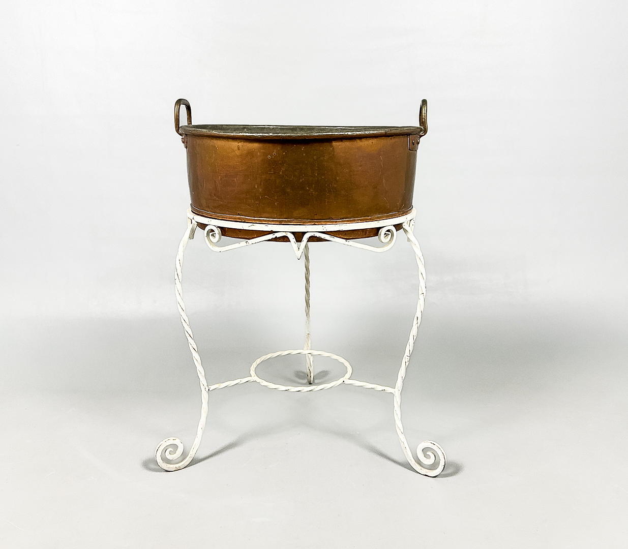 A copper, wrought iron flower table, 20th century.