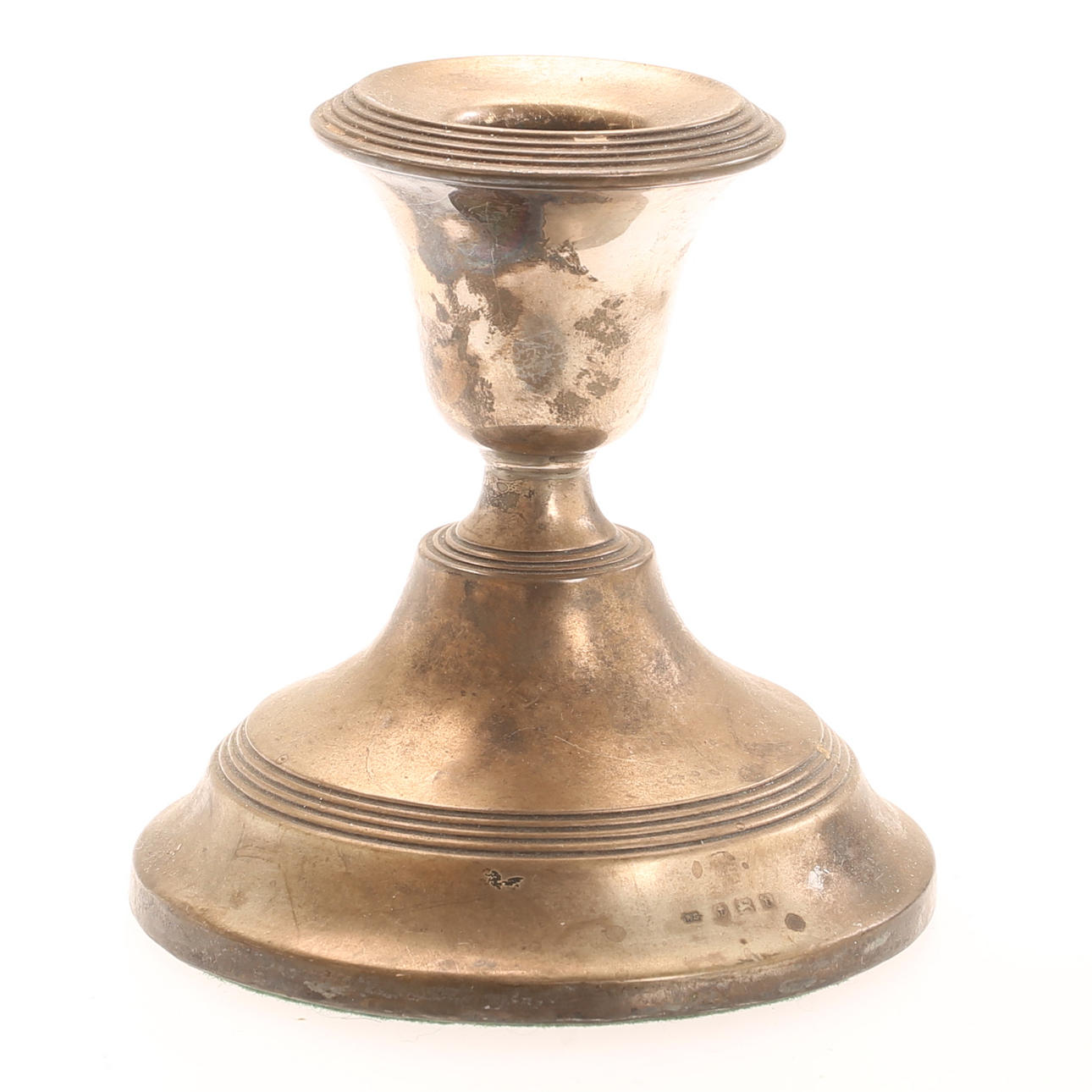A silver candlestick, England.