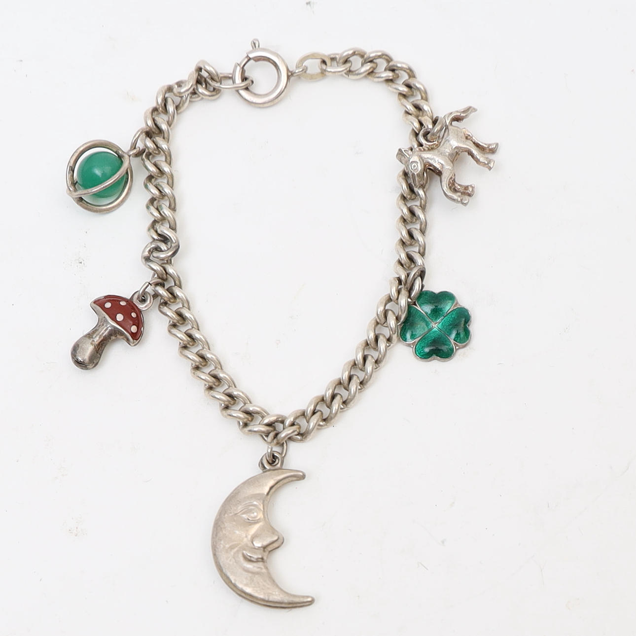 BRACELET, silver, encrusted with charms.