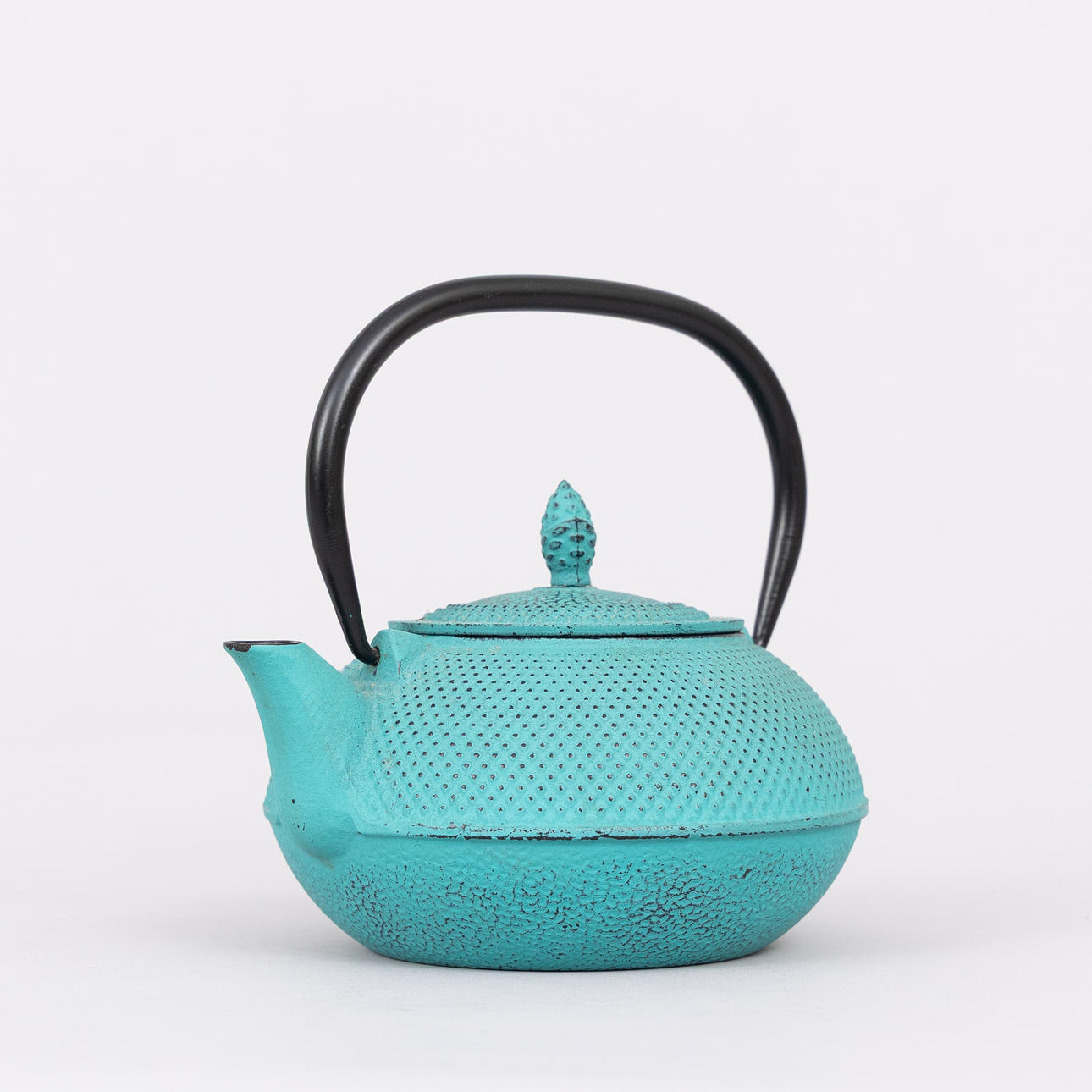 A teapot, cast iron, turquoise, probably Japan.