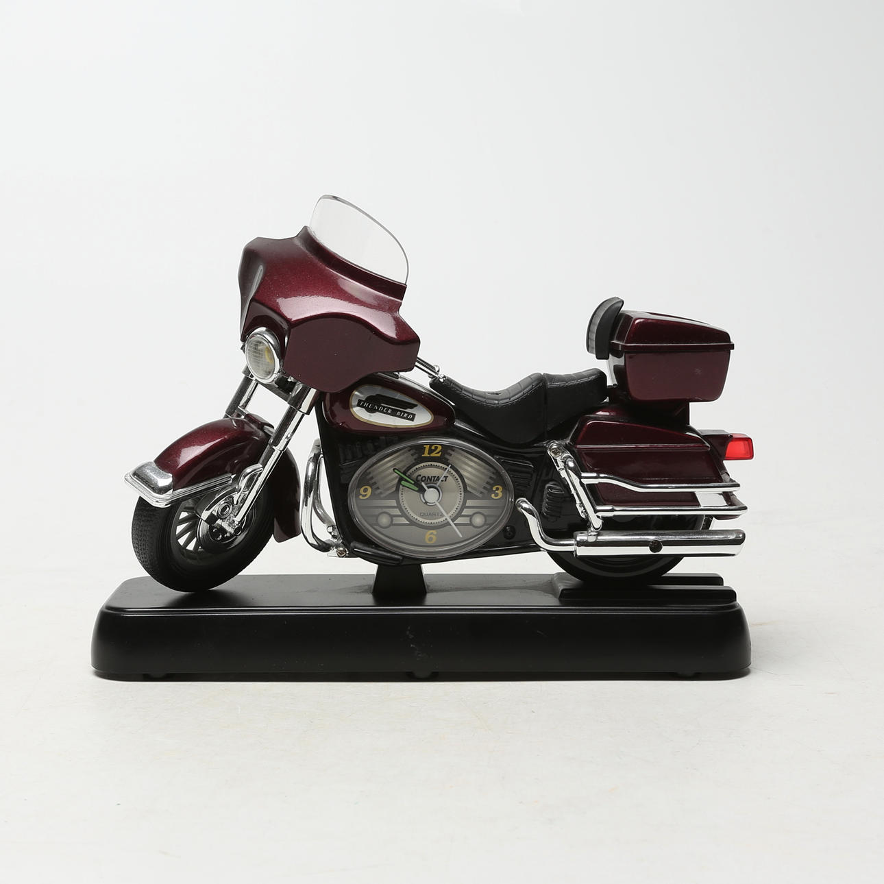 TABLE CLOCK, plastic, in the shape of a motorcycle, battery powered.