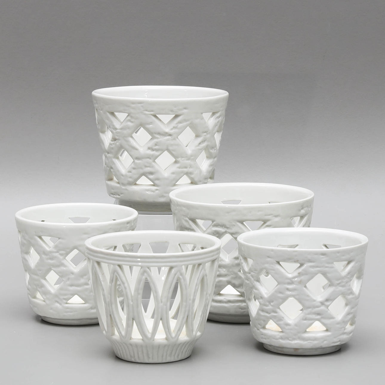 GUNNAR NYLUND. 5 chamotte stoneware outer liners, “Grid pots” & “Olympia”, Rörstrand.