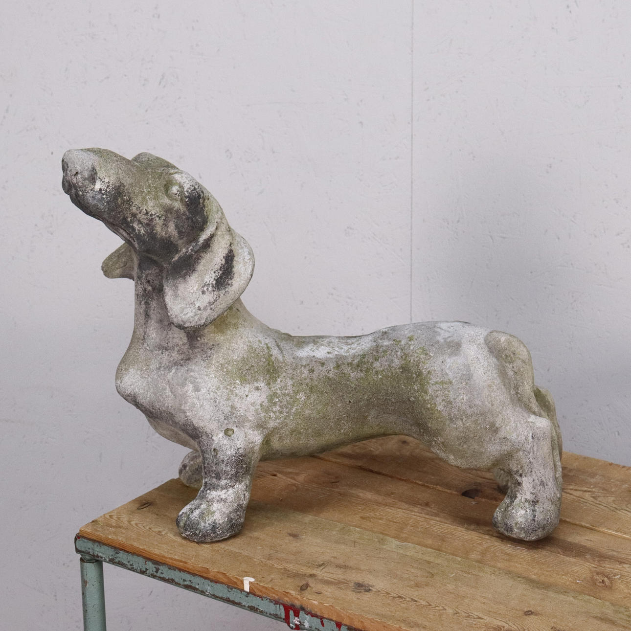 SCULPTURE, DACHSHUND IN CONCRETE.