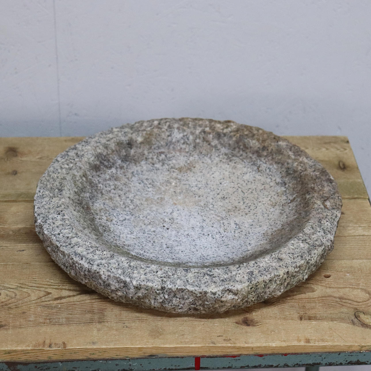 A 20th-century granite BIRDBATH.