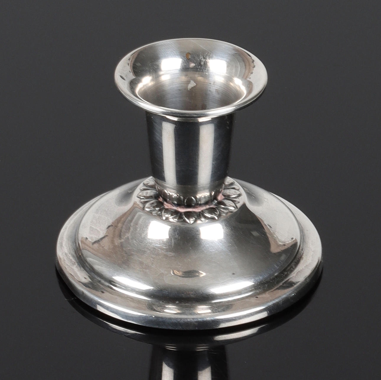 A silver candlestick, 20th century.